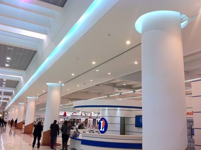 Columns and acoustic ceiling with lighting for a shopping mall