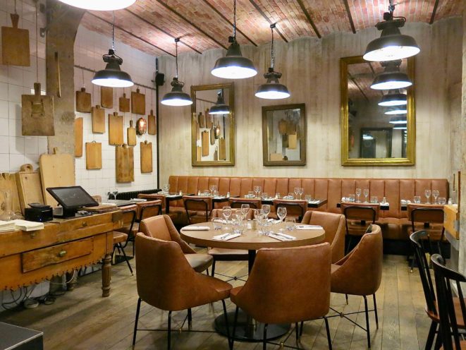 Renovation in a restaurant with an imitation red brick ceiling and imitation wood in wall cladding