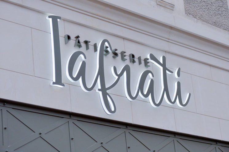 Sign on the new façade of the Ifrati pastry shop